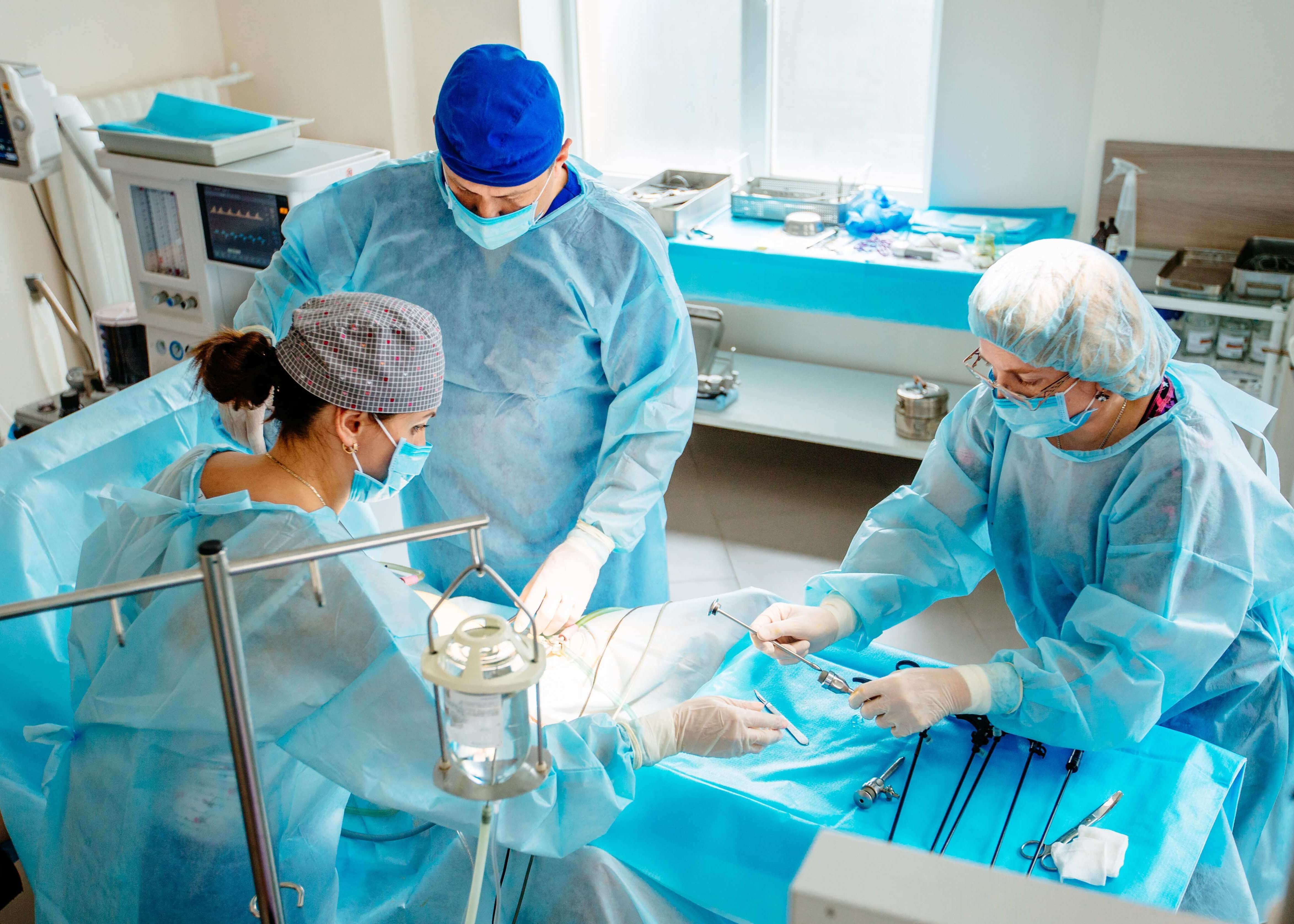 Three surgeons in an operating